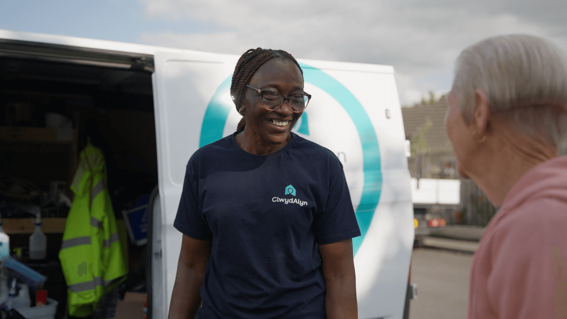 Member of staff smiling with resident